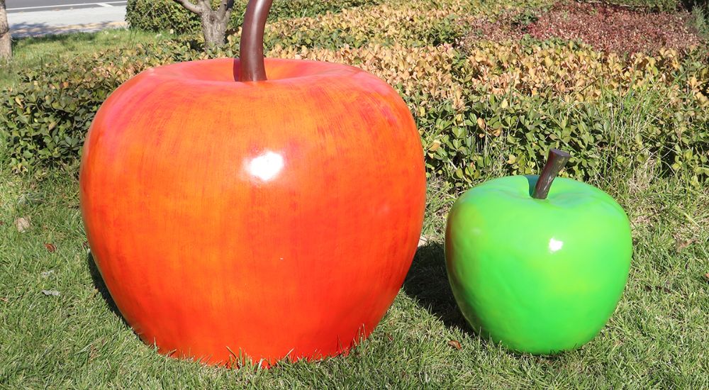 The green apple sculpture and the red apple sculpture