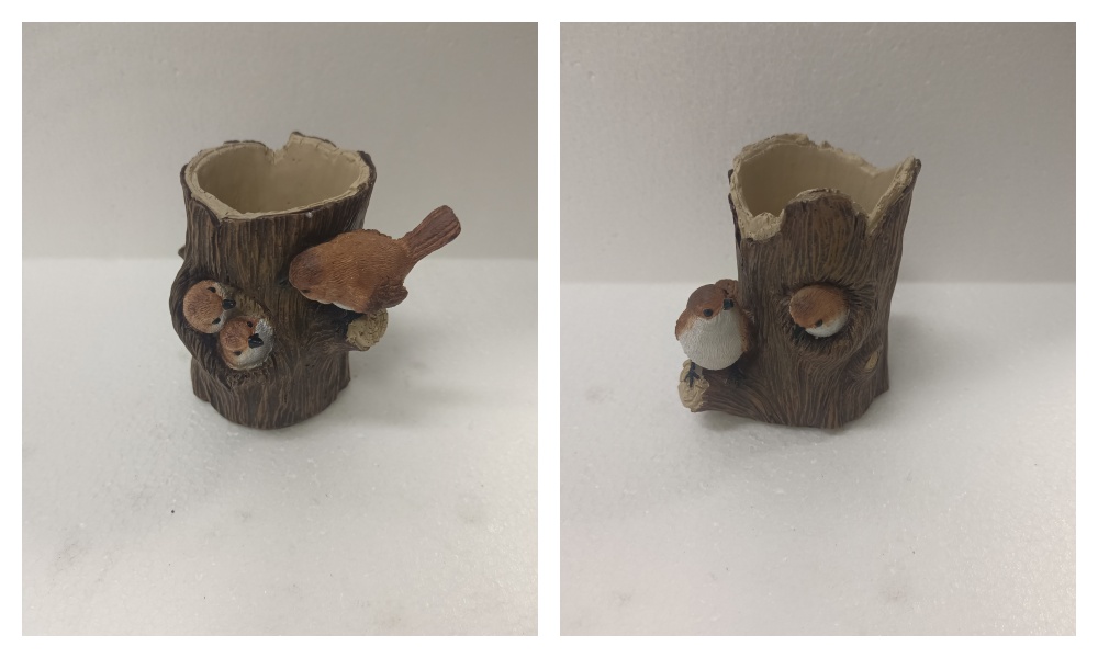 The tree trunk bird pen holder display