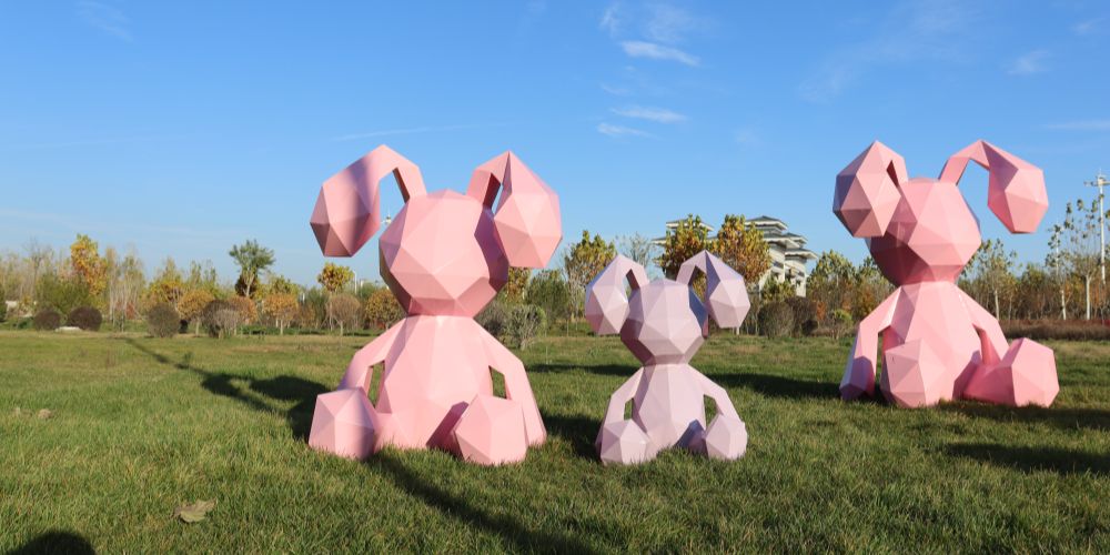 The sitting pink geometric rabbit sculpture