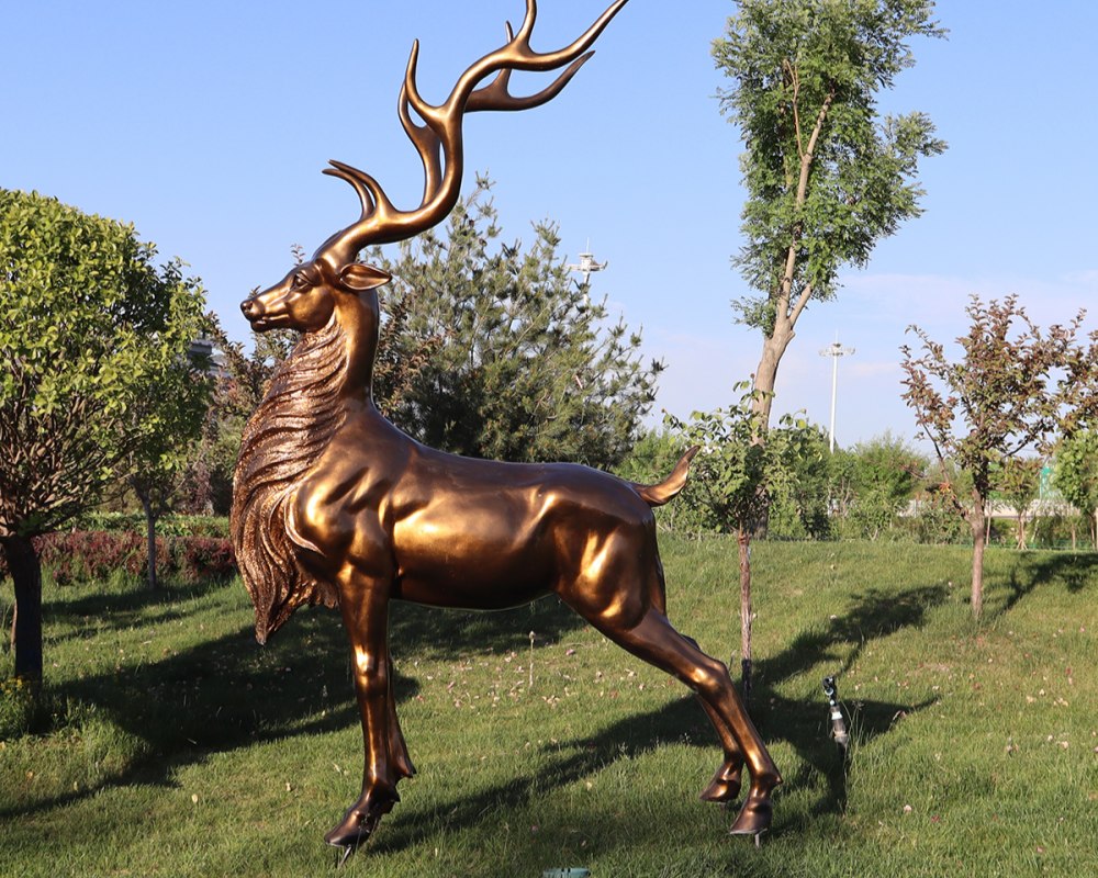 Bronze deer sculpture in park