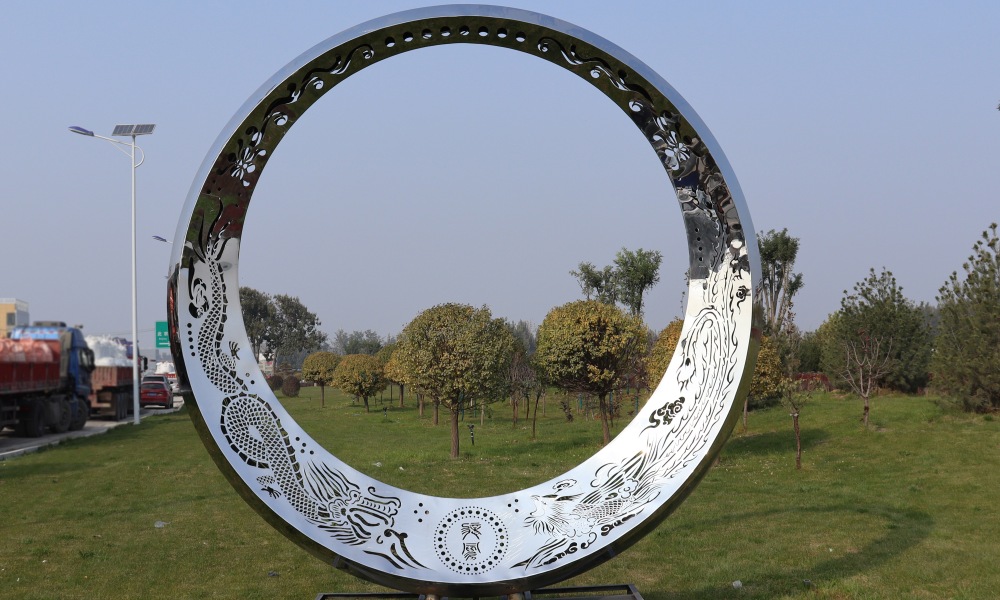 The large round stainless steel sculpture