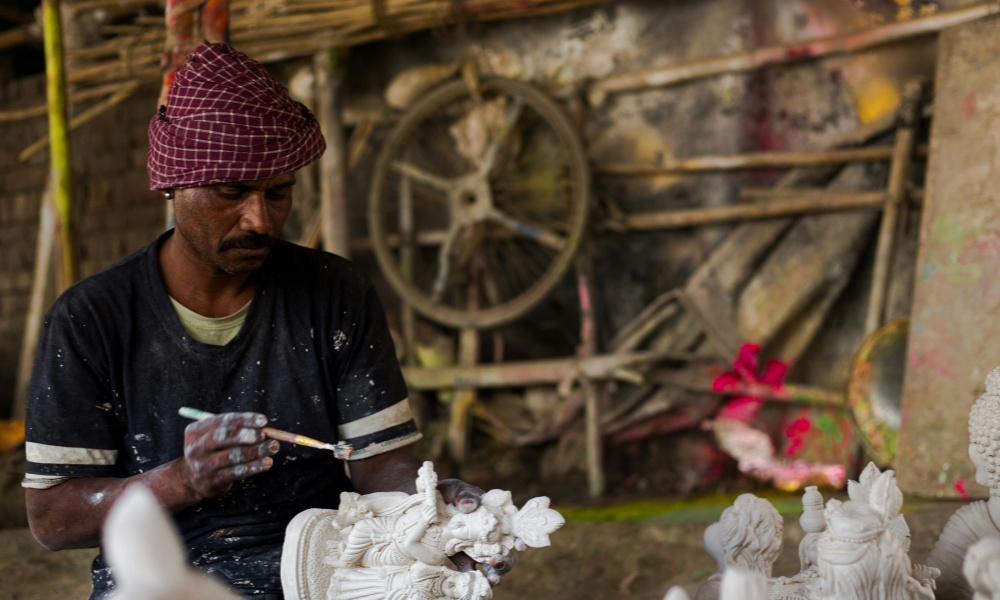 Artist polishing sculpture