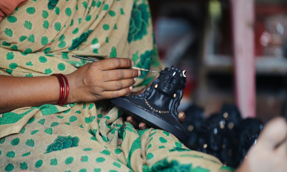 Artist paints sculpture