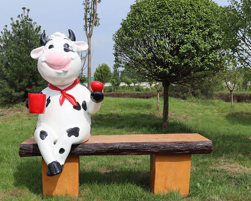Paesaggio in fibra di vetro seduta statue di cartone animato Scultura animale con statua del sedile da banco in vendita