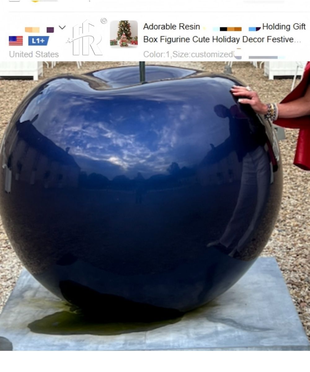 A blue apple-shaped fiberglass sculpture custom-made for a US client.
