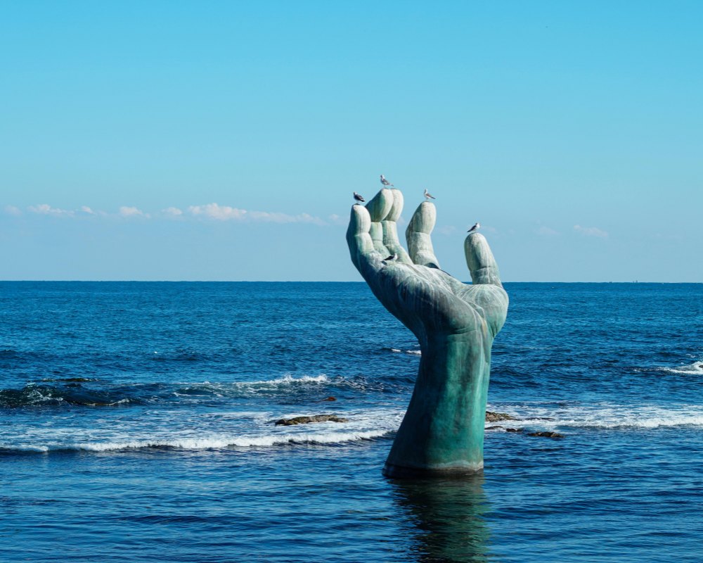 Palm-shaped sculpture at the seaside scenic area