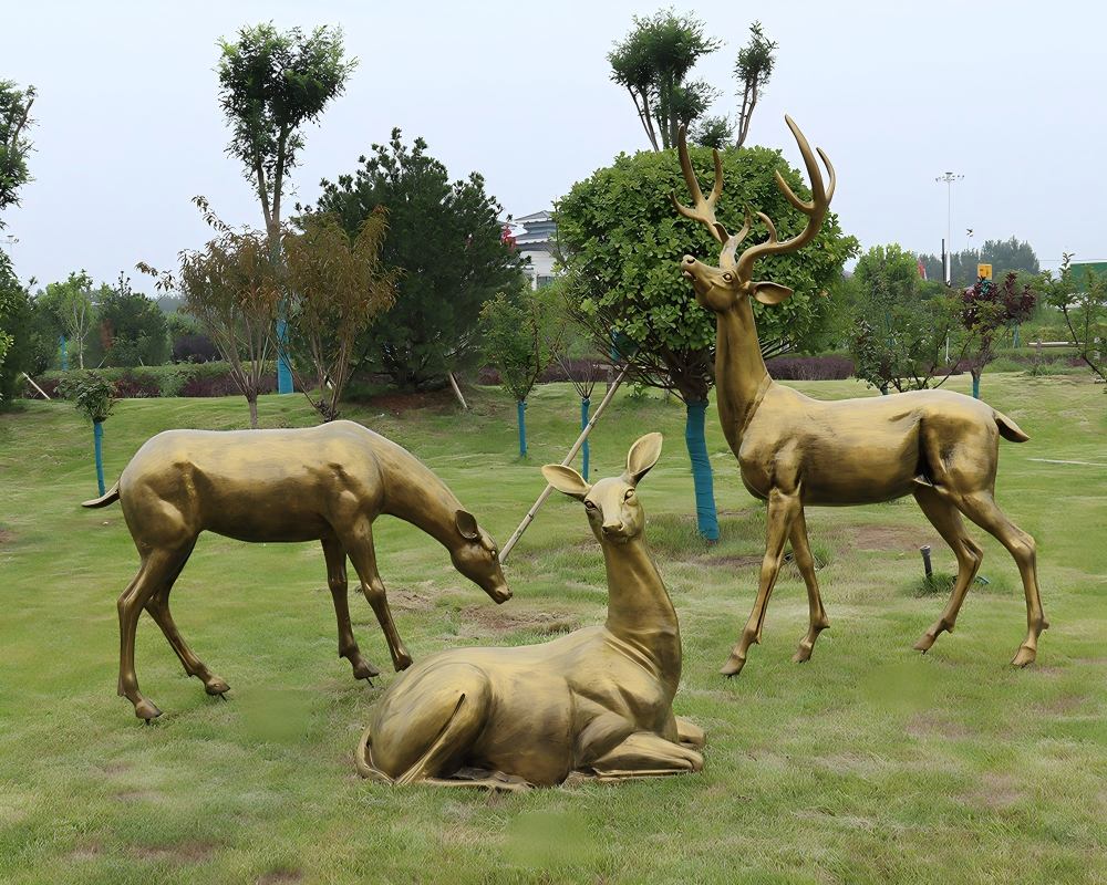Bronze-effect fiberglass sculpture of a group of deer